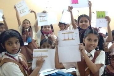 Students actively participating in an internal activity at AK Joshi State Board School, showcasing their creativity and talents in a vibrant and engaging environment.