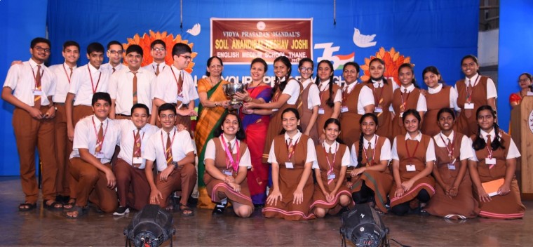 Students participating in a science project presentation at AK Joshi State Board School's Secondary Section in Thane, showcasing academic and non-academic excellence.