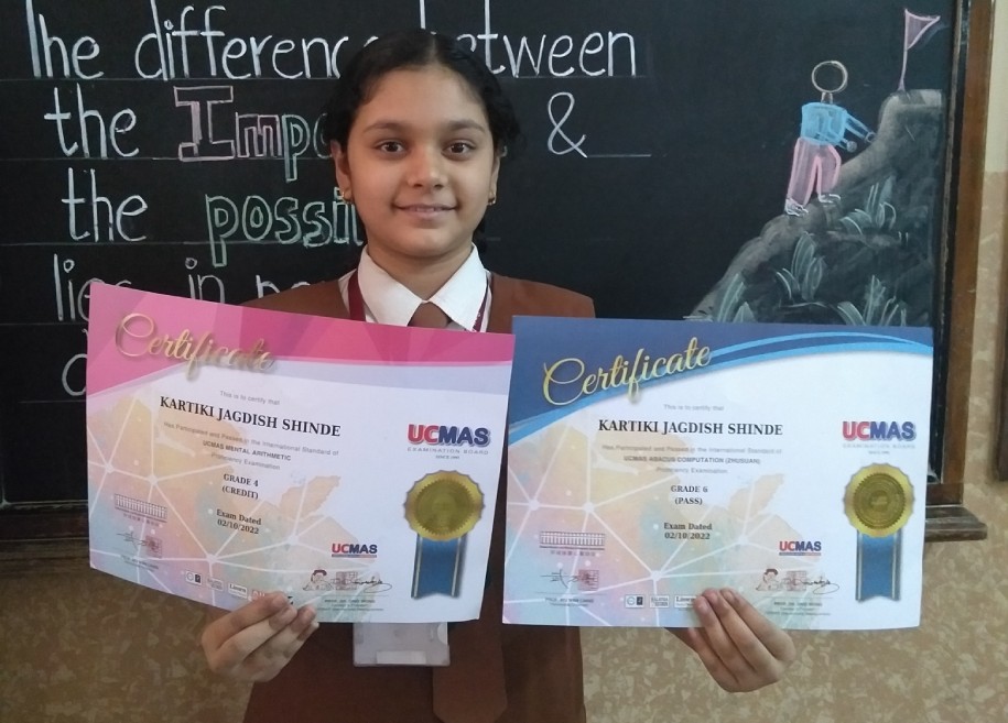 Students proudly displaying their awards and certificates for their outstanding achievements in various competitions and examinations at AK Joshi CBSE School in Thane, representing excellence and success.