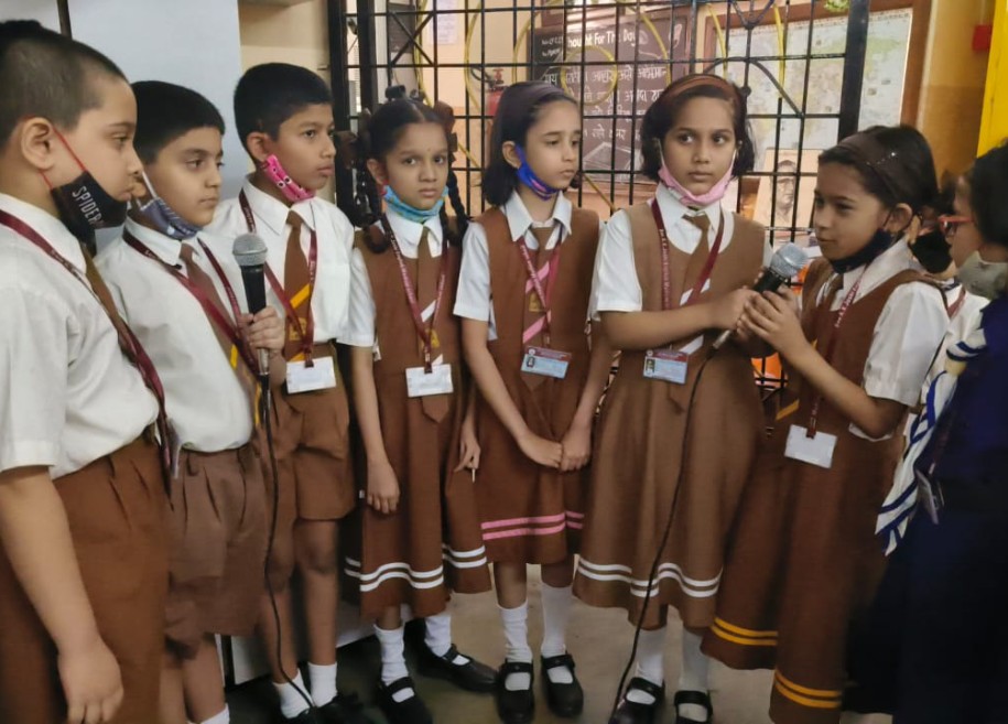 Students proudly displaying their awards and certificates for their outstanding achievements in various competitions and examinations at AK Joshi CBSE School in Thane, representing excellence and success.