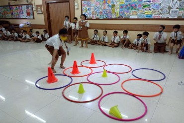 Students actively participating in an internal activity at AK Joshi State Board School, showcasing their creativity and talents in a vibrant and engaging environment.