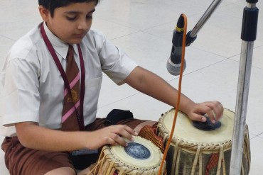 Students actively participating in an internal activity at AK Joshi State Board School, showcasing their creativity and talents in a vibrant and engaging environment.